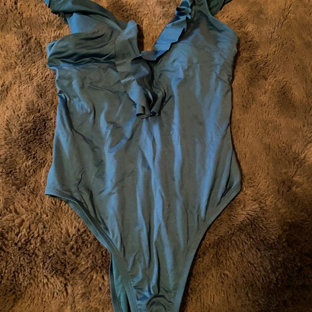 New with tags. Shade and shore one piece blue ruffle swimsuit